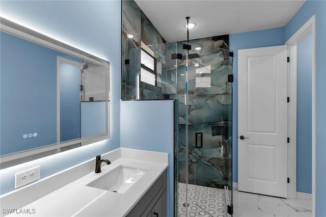 bathroom featuring walk in shower and vanity