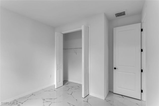 unfurnished bedroom with a closet