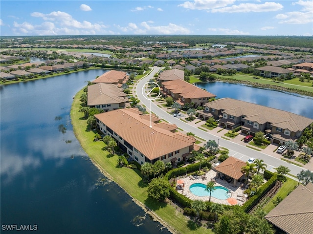 birds eye view of property featuring a water view and a residential view