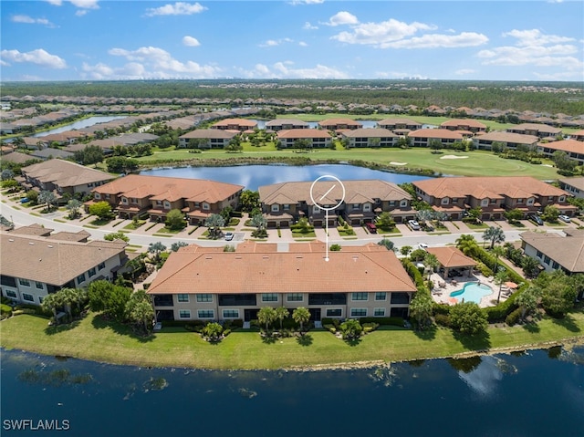 birds eye view of property featuring a water view and a residential view