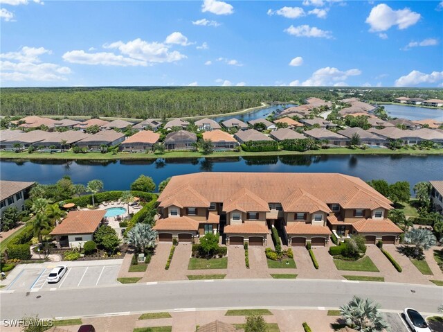 birds eye view of property featuring a residential view and a water view