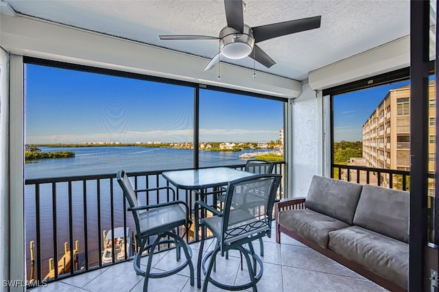 4835 Bonita Beach Rd Unit 408, Bonita Springs, FL 34134 - sunroom with ceiling fan and a water view