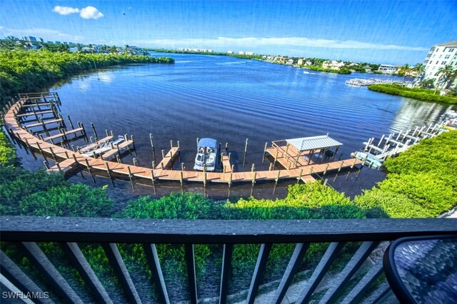 4835 Bonita Beach Rd Unit 408, Bonita Springs, FL 34134 - dock area with a water view and boat lift
