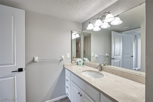 4835 Bonita Beach Rd Unit 408, Bonita Springs, FL 34134 - bathroom featuring baseboards, a textured ceiling, and vanity