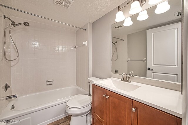 4835 Bonita Beach Rd Unit 408, Bonita Springs, FL 34134 - full bath featuring toilet, a textured ceiling, bathing tub / shower combination, and visible vents