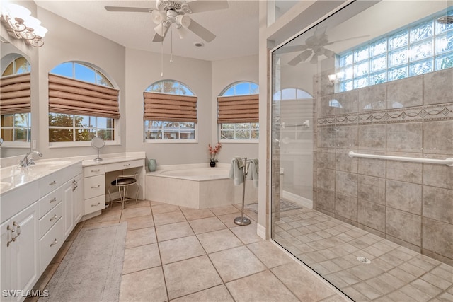 bathroom featuring a wealth of natural light, vanity, and ceiling fan