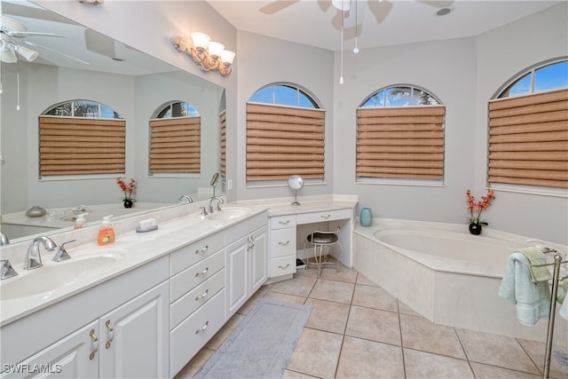 bathroom with vanity, a bathing tub, ceiling fan, and tile patterned flooring