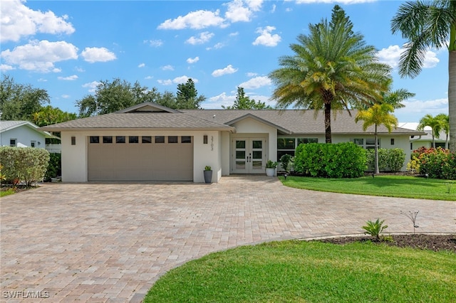 single story home with a front lawn and a garage