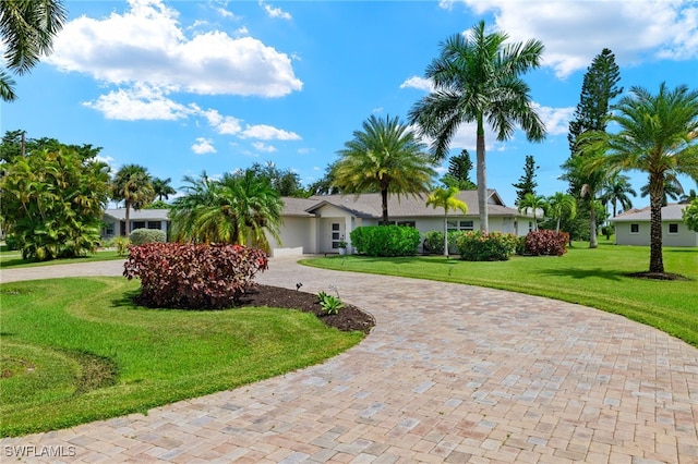 single story home with a front yard