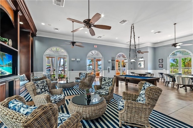 tiled living room with french doors, billiards, crown molding, and ceiling fan