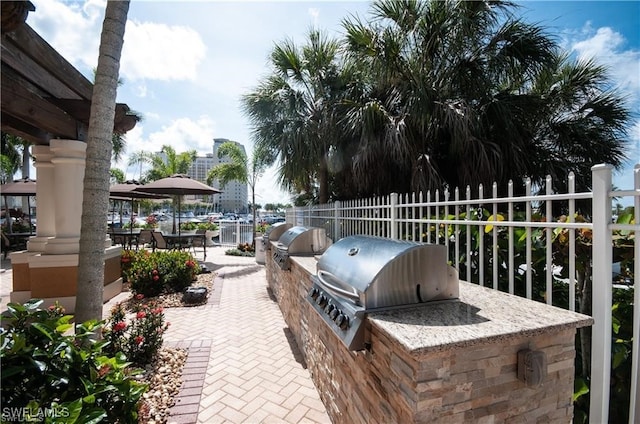 view of patio / terrace with area for grilling and a grill