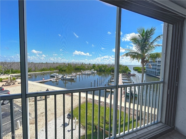 balcony featuring a water view