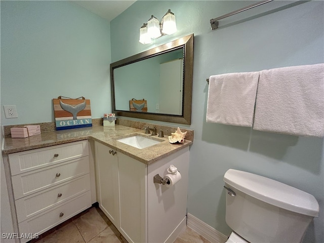 bathroom featuring vanity, toilet, and tile patterned floors