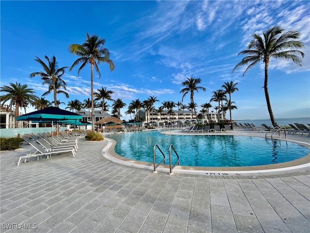 view of pool with a water view