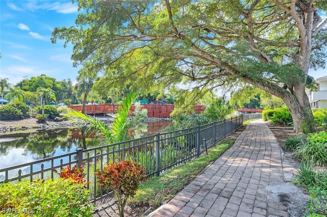 view of home's community with a water view