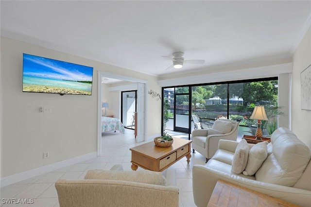 living room featuring plenty of natural light, ceiling fan, and ornamental molding