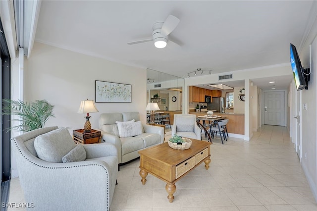 tiled living room featuring ceiling fan and crown molding