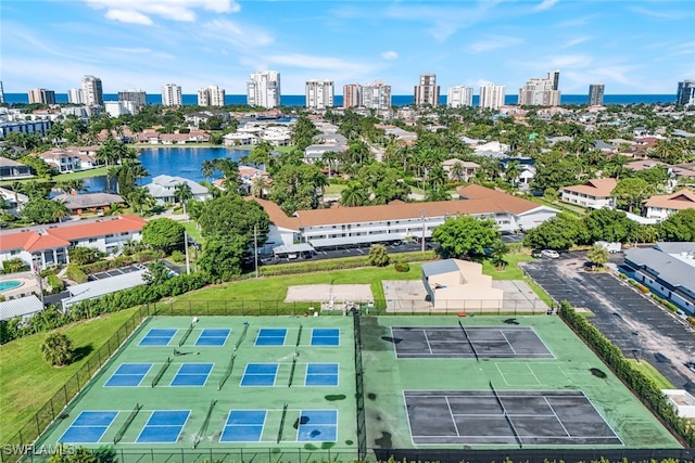 birds eye view of property with a water view