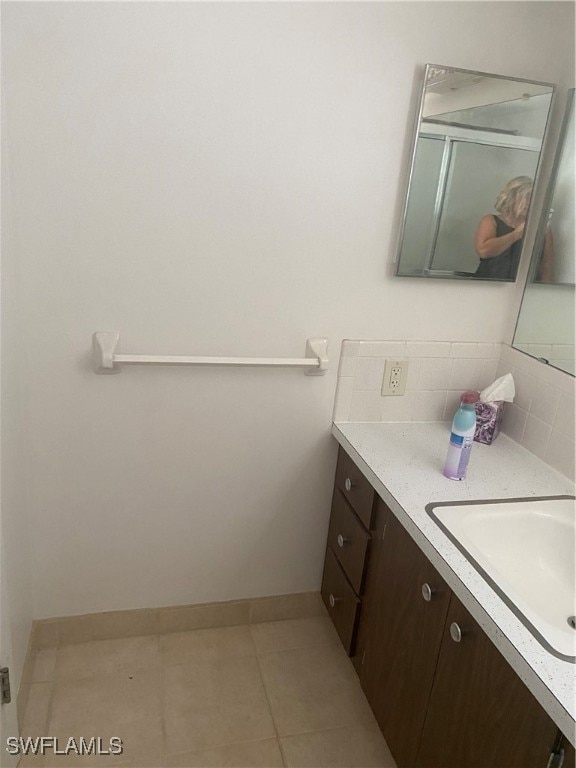 bathroom with vanity and tile patterned floors