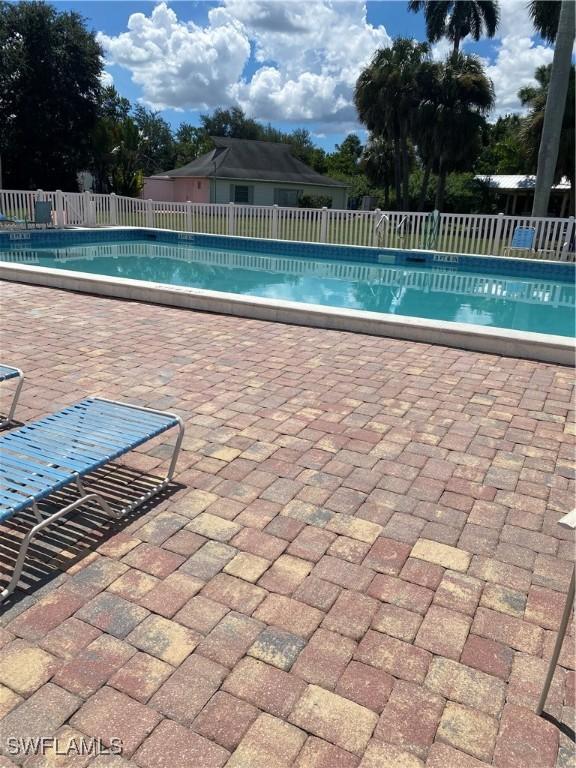 view of pool with a patio area, fence, and a fenced in pool