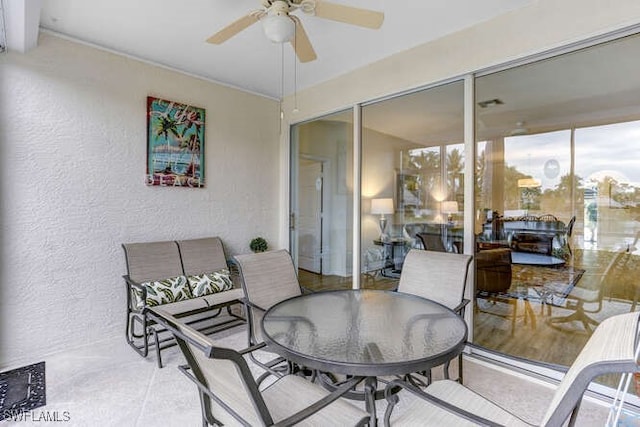 sunroom with a ceiling fan