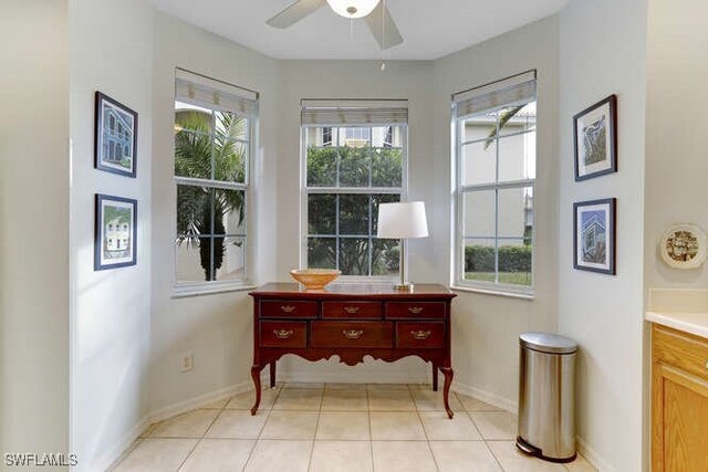 interior space featuring ceiling fan and light tile patterned flooring