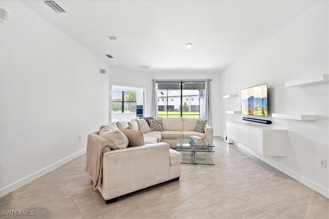 living room featuring light tile patterned floors