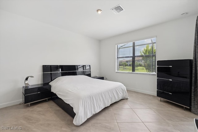 bedroom featuring light tile patterned floors