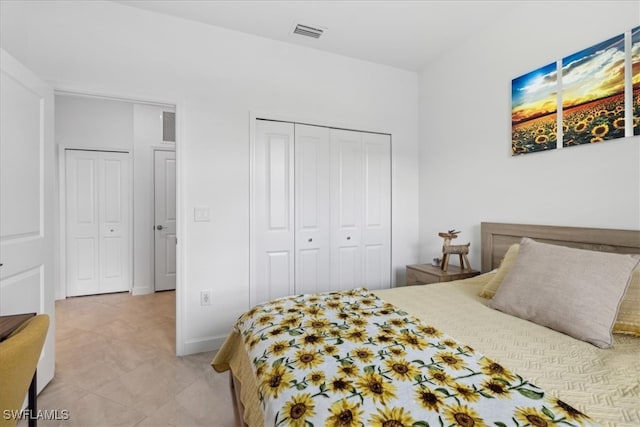 bedroom featuring light carpet and a closet