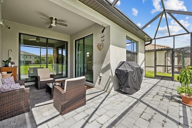 view of patio / terrace featuring an outdoor living space, a lanai, ceiling fan, and a grill