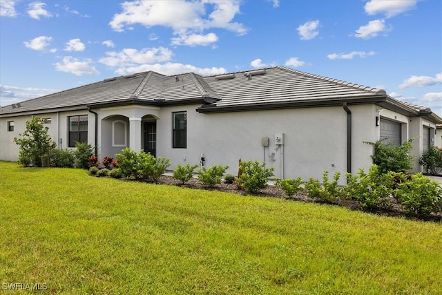 exterior space with a front lawn and a garage