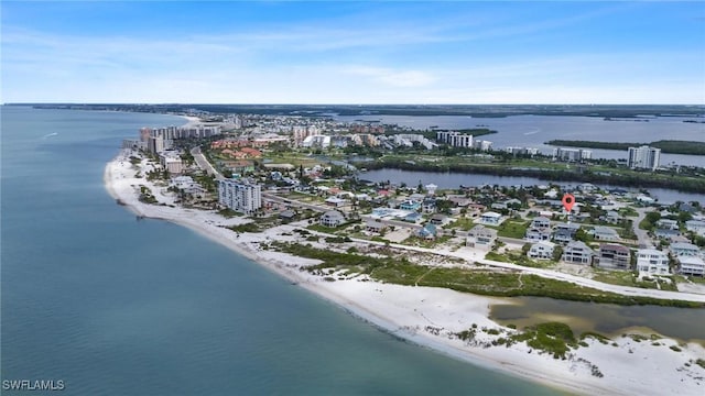 drone / aerial view with a view of the beach, a water view, and a city view