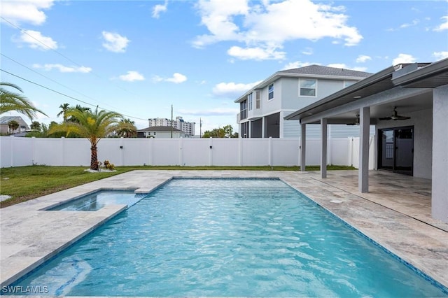 view of pool with ceiling fan, a patio, a fenced backyard, and a fenced in pool