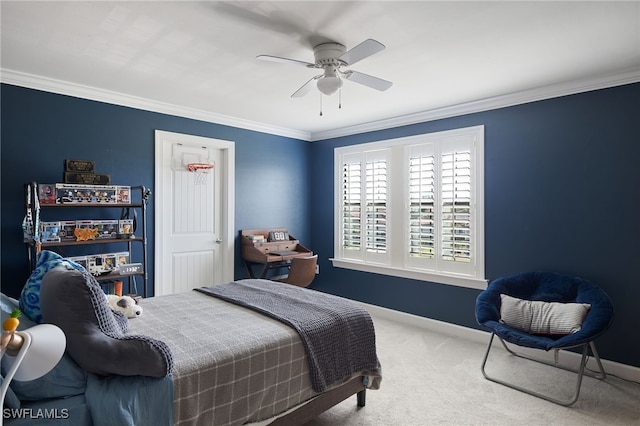 bedroom with ceiling fan, ornamental molding, and carpet floors