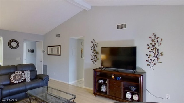 living room with light hardwood / wood-style flooring, beam ceiling, and high vaulted ceiling