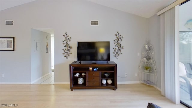 living room with lofted ceiling and light hardwood / wood-style floors