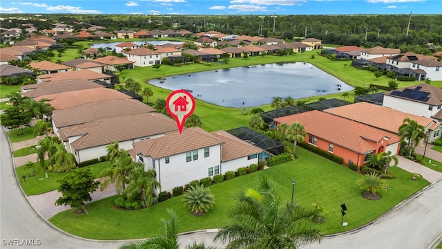 birds eye view of property with a residential view and a water view