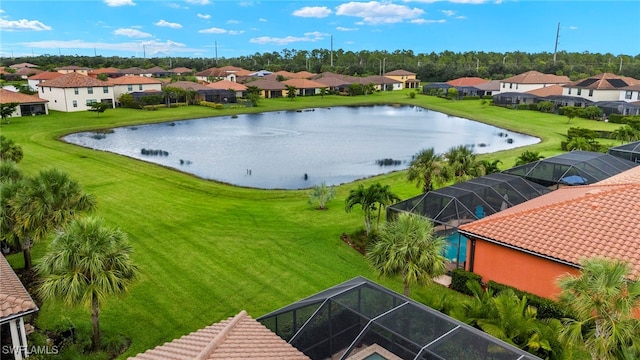 aerial view featuring a water view and a residential view