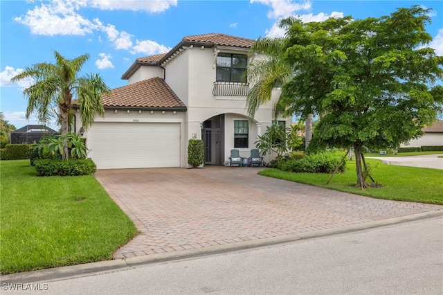 10860 Essex Square Blvd, Fort Myers, FL 33913 - mediterranean / spanish house featuring a garage, decorative driveway, a balcony, and a front yard
