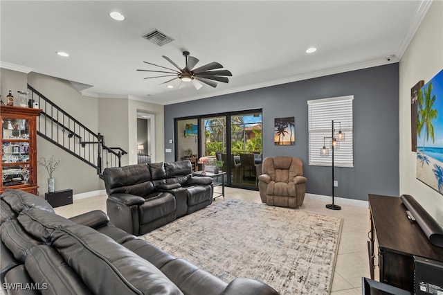 living room featuring light tile patterned floors, ceiling fan, and ornamental molding