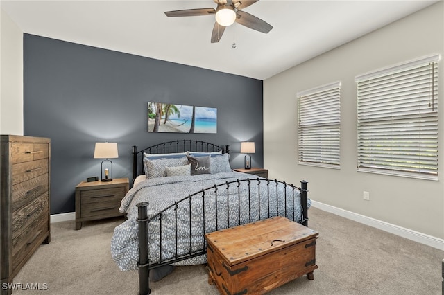 bedroom featuring ceiling fan and light carpet