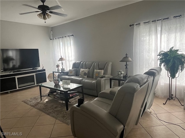 living room featuring ceiling fan and light tile patterned flooring