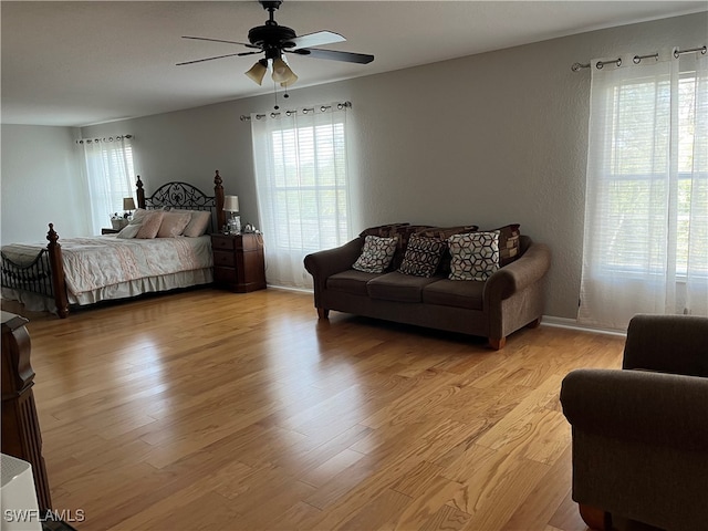 bedroom featuring light hardwood / wood-style floors and ceiling fan