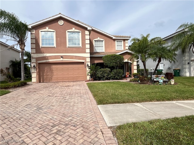 view of front of house with a front yard and a garage