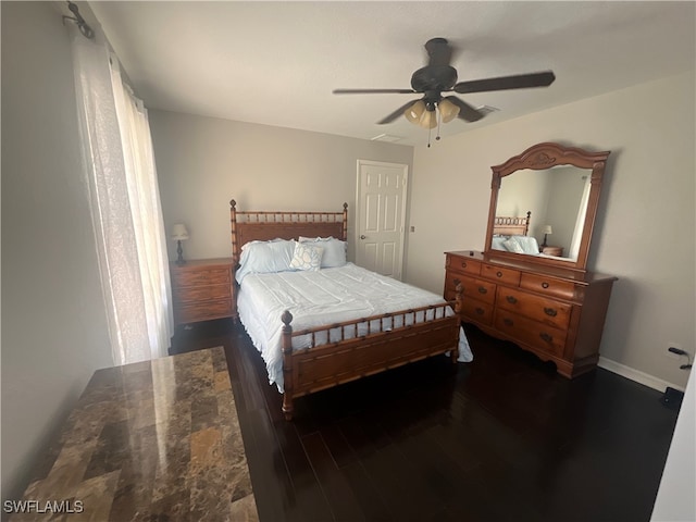 bedroom featuring ceiling fan and dark hardwood / wood-style floors