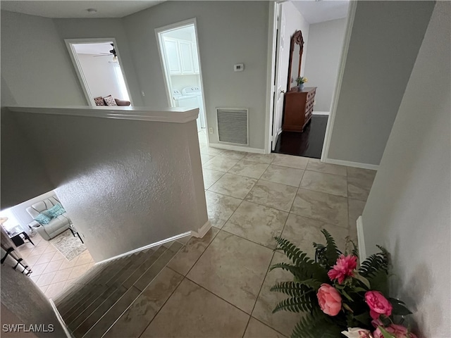 hall with tile patterned flooring