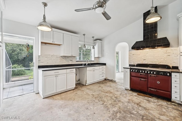 kitchen with white cabinets, ceiling fan, tasteful backsplash, and sink