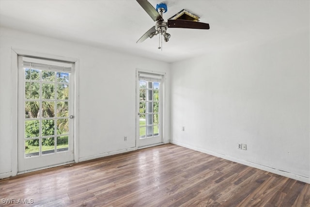 spare room featuring plenty of natural light and ceiling fan