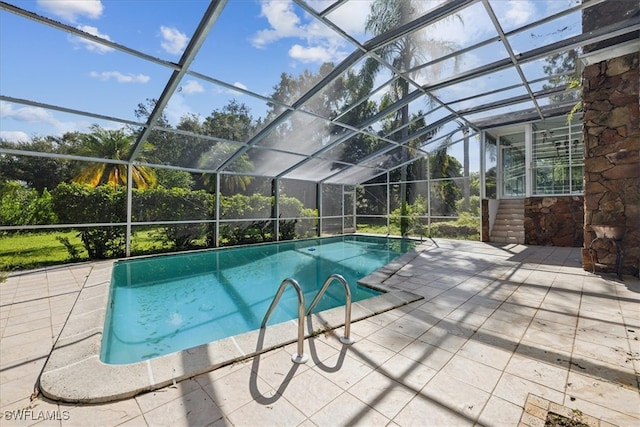 view of pool featuring a lanai and a patio