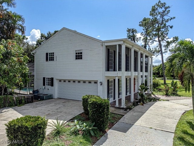 view of side of home featuring a garage